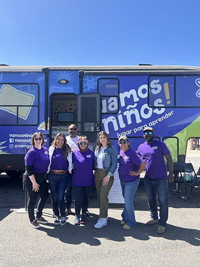 group photo of the CPC team in front of the Vamos Ninos bus